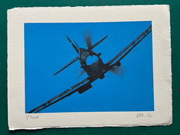 An RAF Spitfire from World War Two flies towards the camera, its propellor whirring