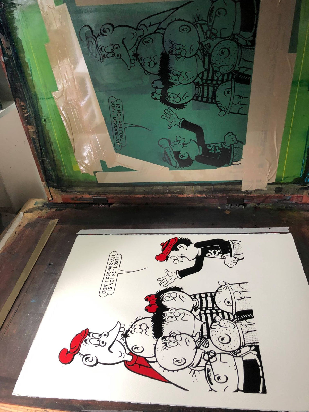 A screenprint of the Bash Street Kids just after the black ink has been applied