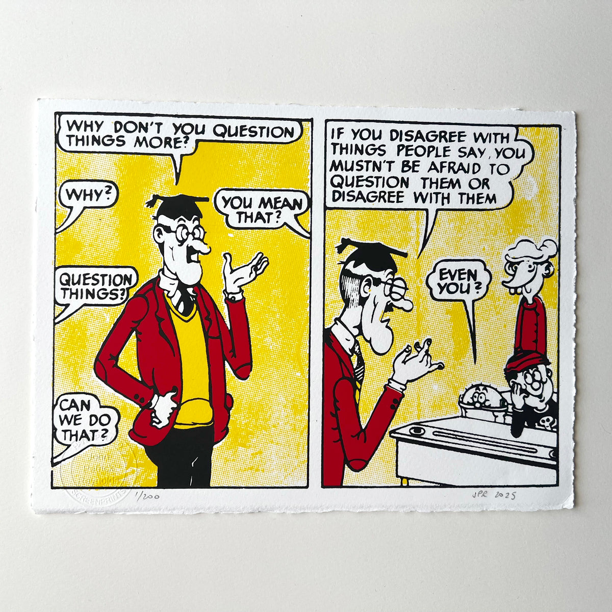 A square art print featuring a two-panel cartoon comic with black line drawings and speech bubbles on a yellow background, mounted against a light gray wall.