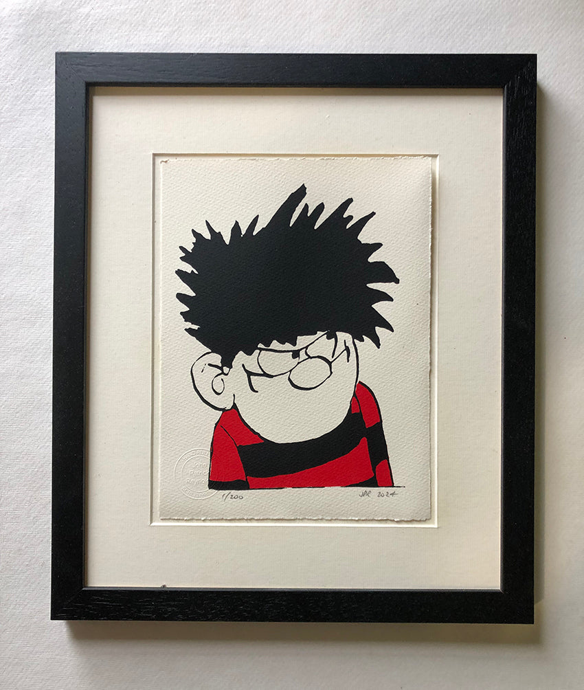 Dennis the Menace from the Beano comic in spikey hair and red and black jersey glares.