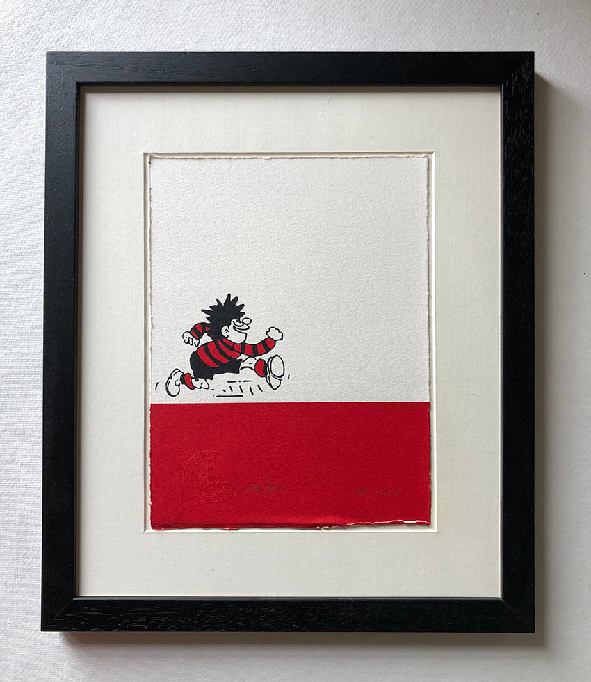 Dennis the menace runs happily on a bar of red ink. From the Beano