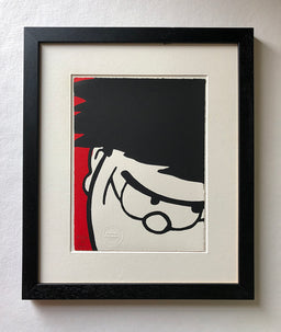 Dennis menace cracks a sly grin, in closeup. With a red background. From the beano comic