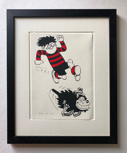 Dennis the menace in red and black stripey jersey runs with gnasher. From the beano comic. Approved by publisher dc thomson 