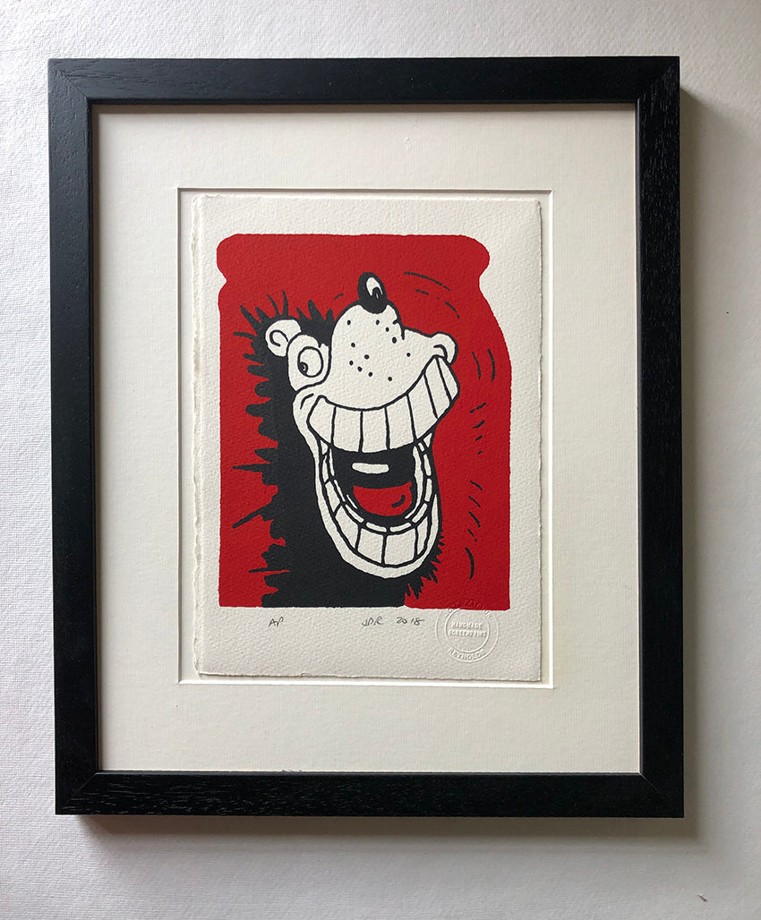 Gnasher from the Beano comic grins and shows off his enormous teeth. On red background. 
