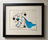 Dogmatix from the Asterix series looks sad underneath a blue blanket