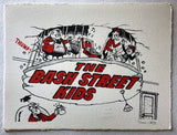 The Bash Street Kids in red clothes are dancing to a portable record player it brings the ceiling down upon Teacher 