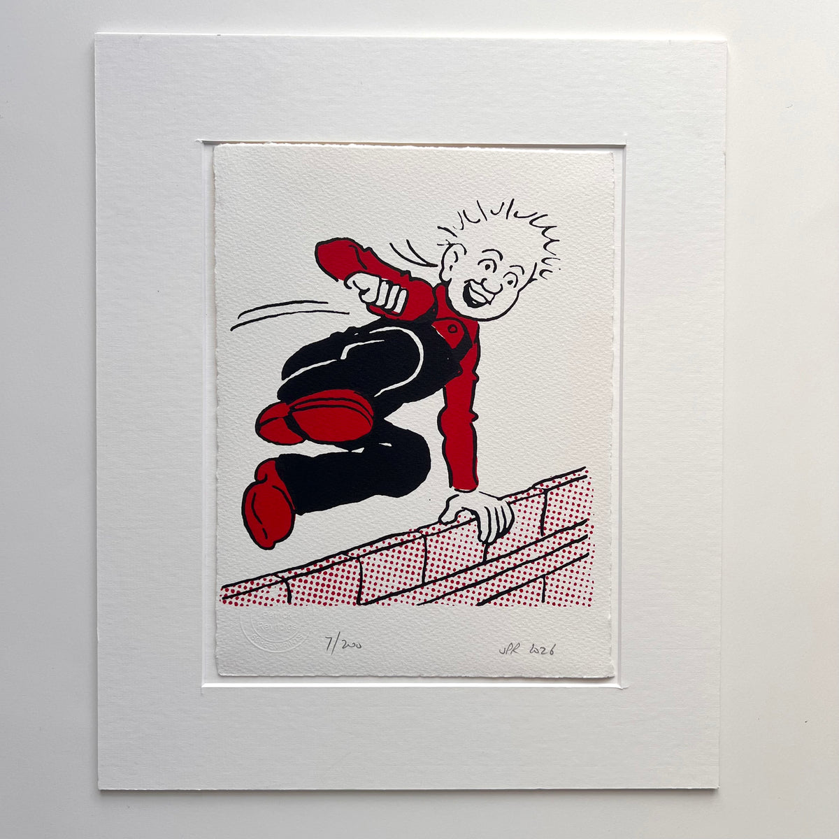 Oor Wullie gleefully vaults a wall