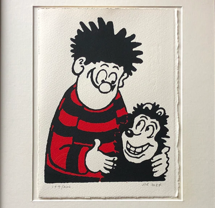 Dennis hugs Gnasher