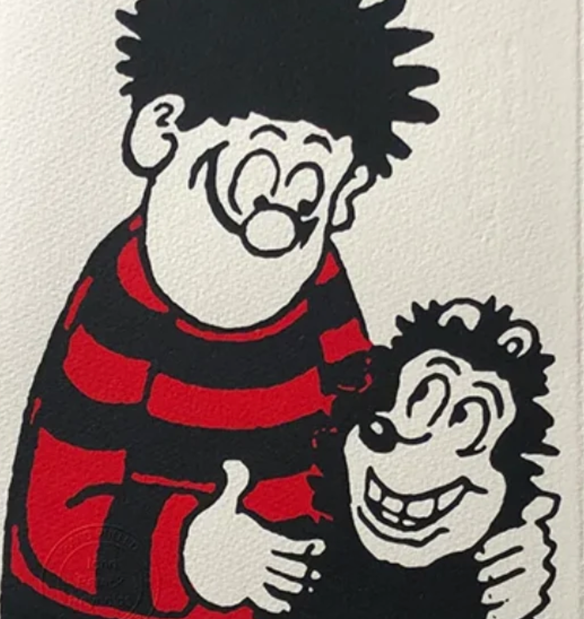 Dennis hugs Gnasher