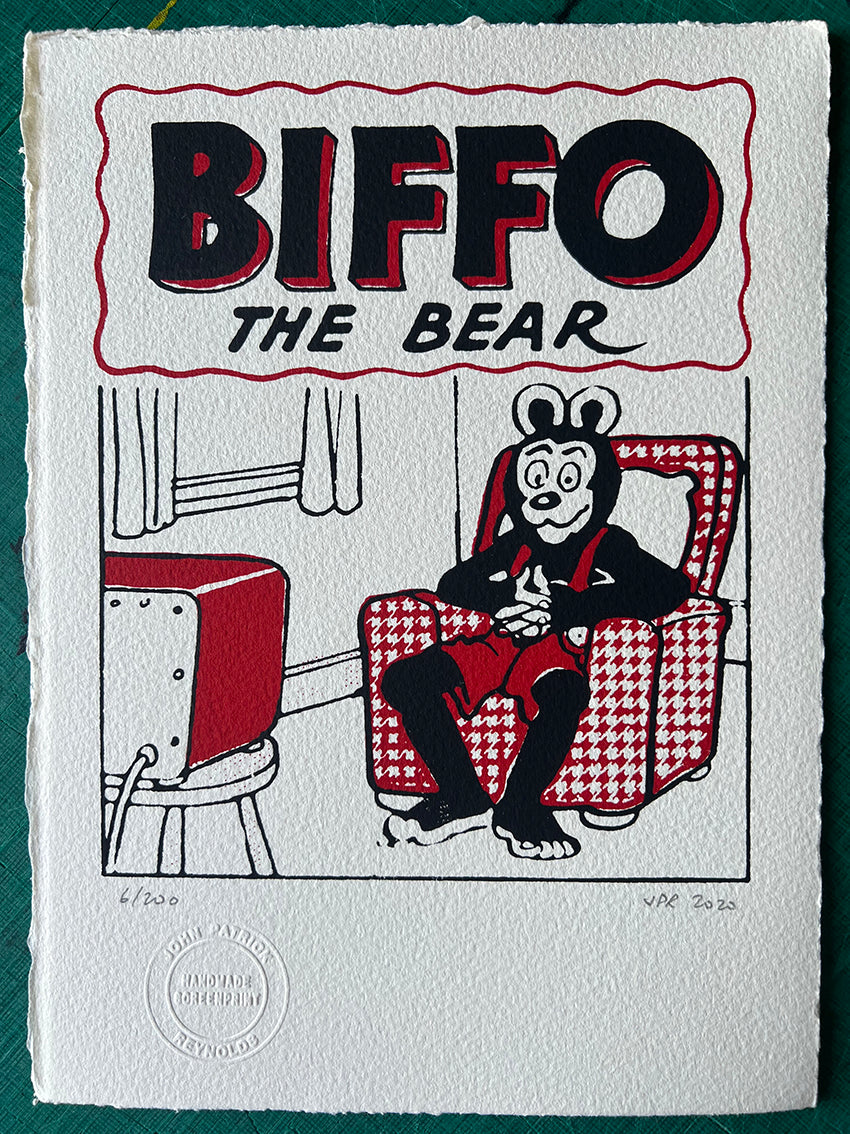 Biffo watches telly from his comfy chair
