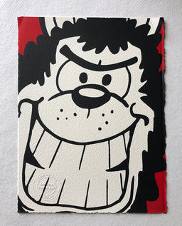 Gnasher the dog grins manically at the reader with a red background. From the beano comic