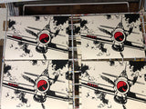 Four prints on a drying rack showing the RAF hurricane fighter with a red nose flies at the reader. 
